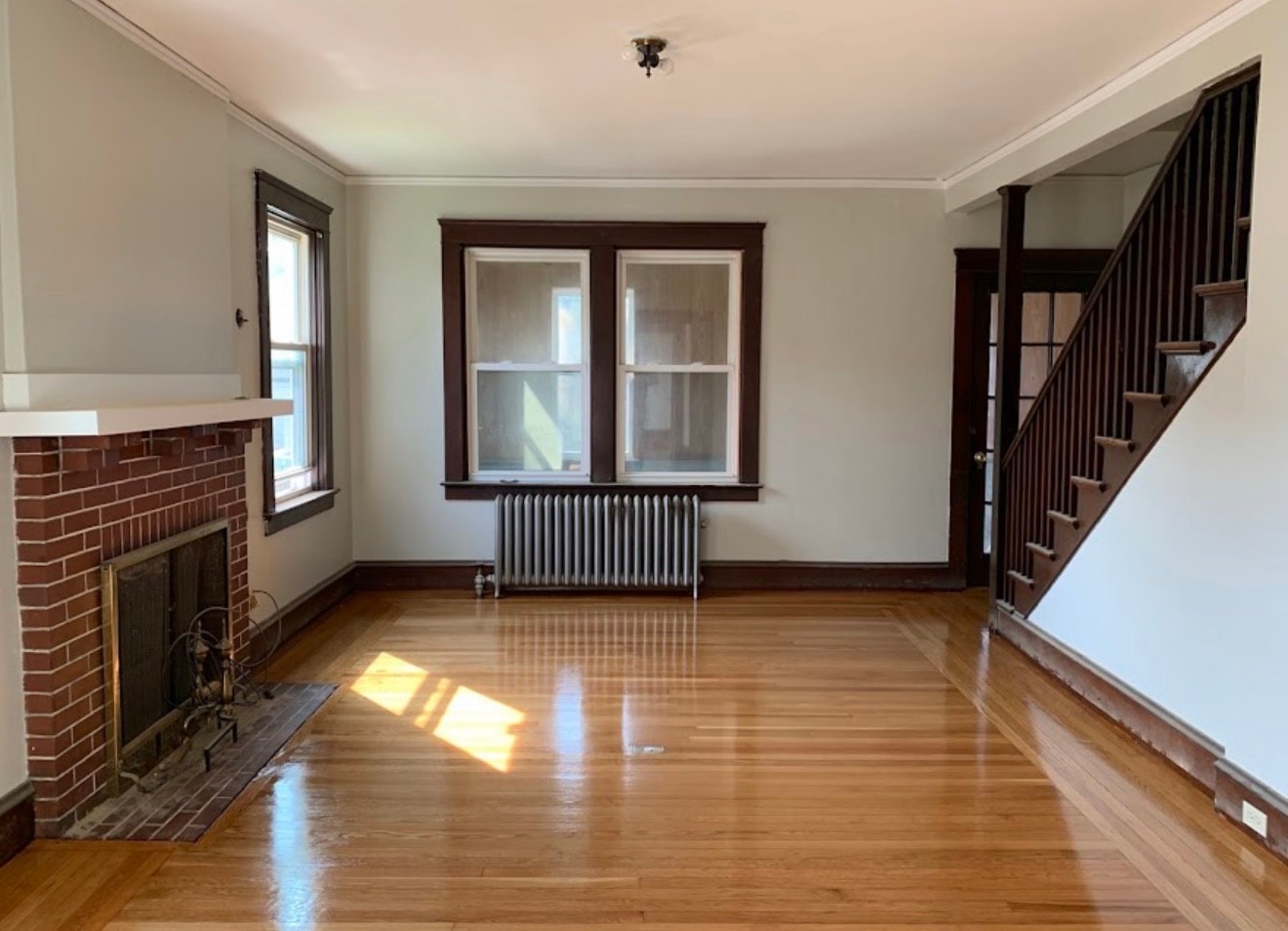 Refinished hardwood floors with fireplace