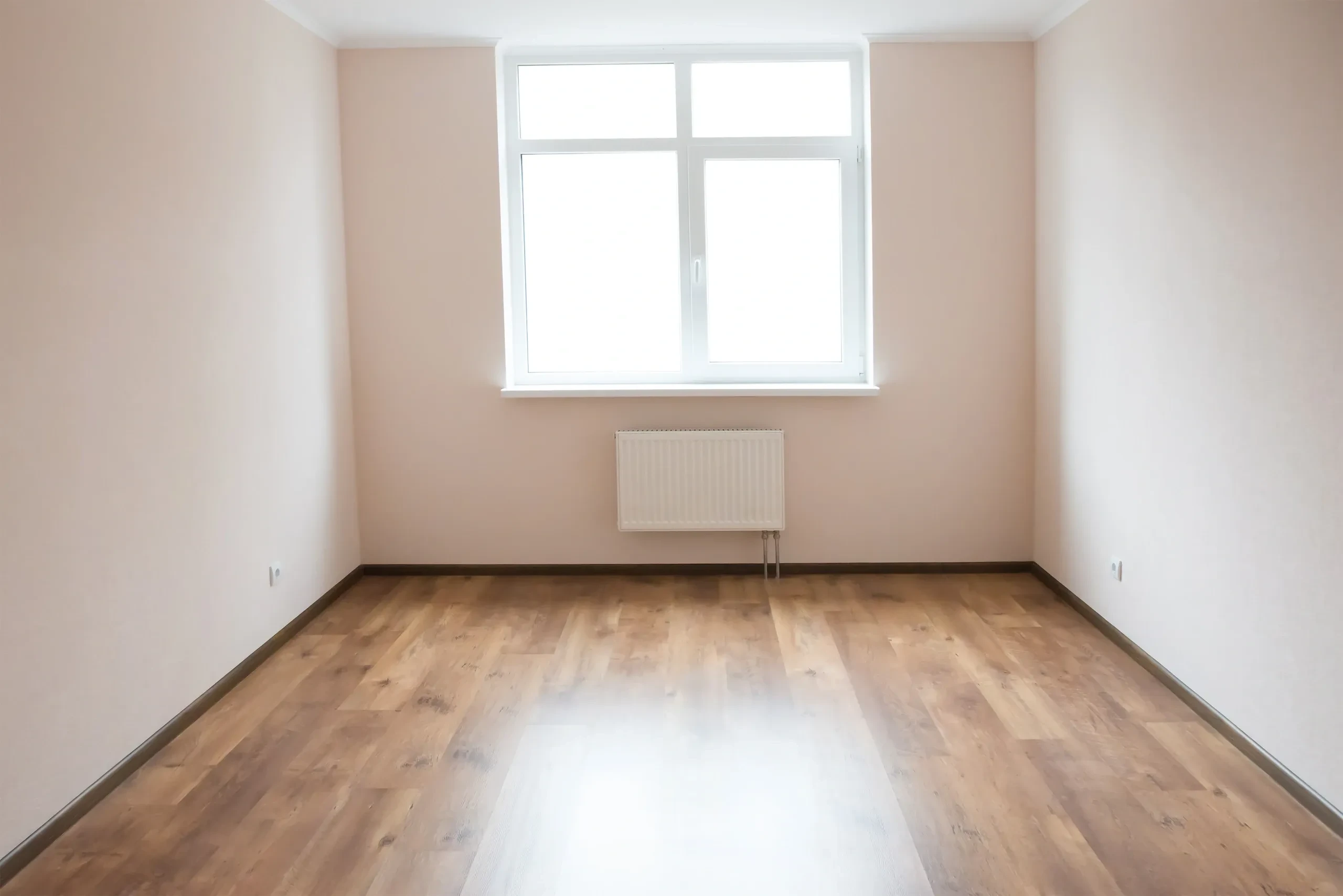 Empty room with hardwood floors